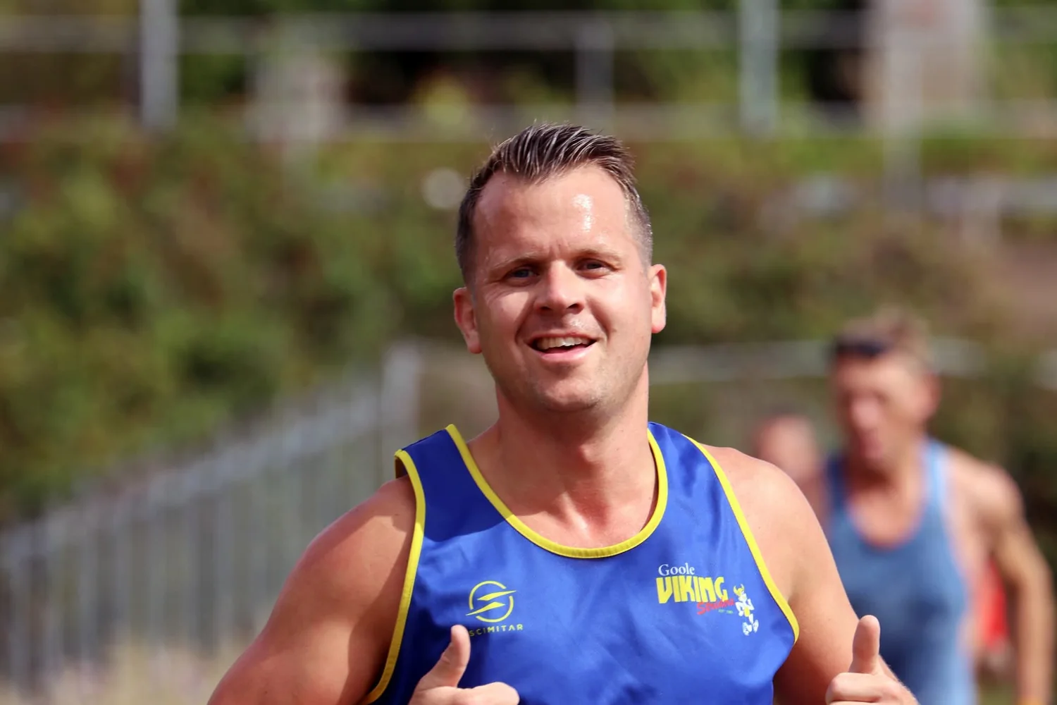 A runner smiling for the camera during the 2026 Riverbank Challenge